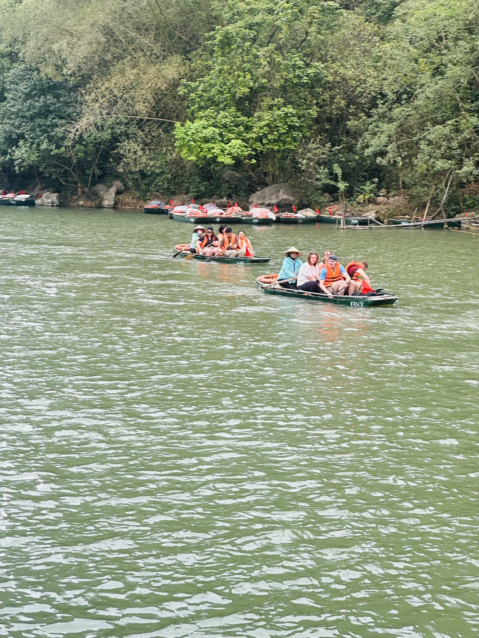 Active travelers enjoy kayaking in the peaceful waters of Trang An